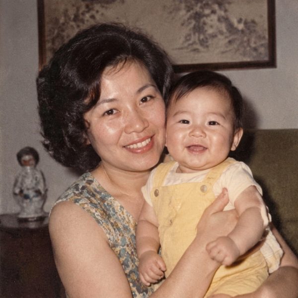 A mother holding her baby, restored